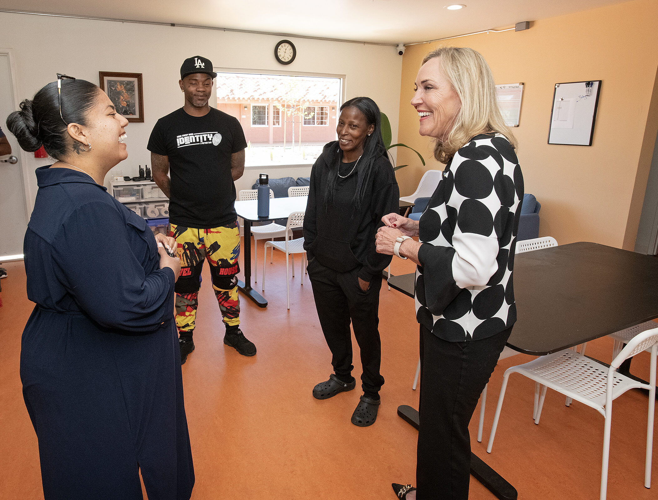 Supervisor Kathryn Barger (far right) pays a visit to The Sierra's and brings welcome home packages to its new residents, including Daniel and Shanika. She is greeted by Hope of the Valley program manager, Melissa Amezcua (far right). Photo by Diandra Jay/Los Angeles County.