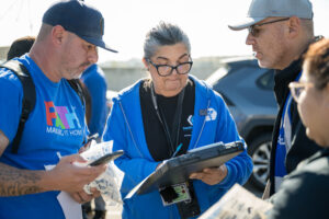 LA County Department of Health Services substance abuse counselor Lorraine Hundtoft organizes with workers before a Pathway Home operation in South Gate.
