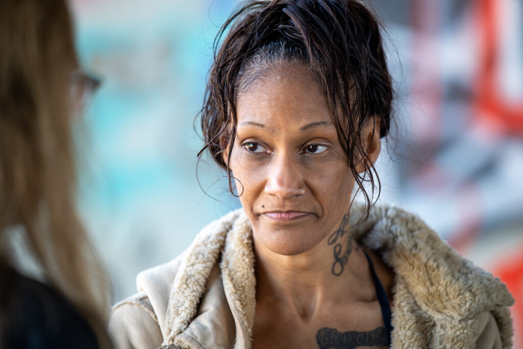 Karicha at her encampment before moving to interim housing during a Pathway Home operation in South Gate, Dec. 10, 2025. (Photo by Michael Owen Baker)