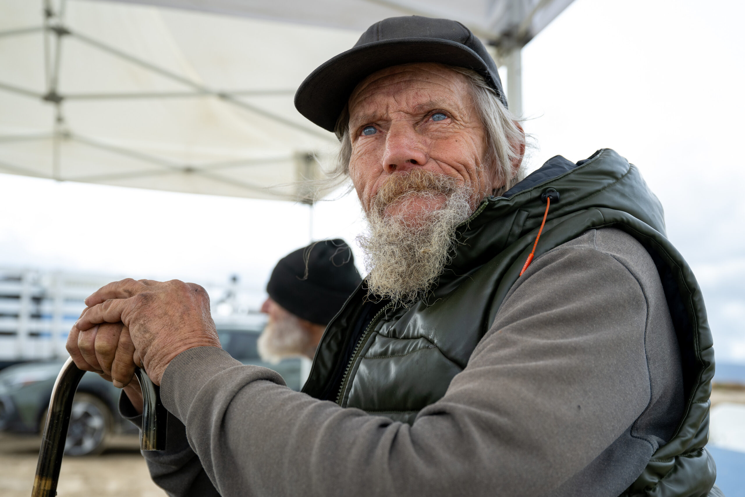 Robert waits for transportation to interim housing during a Pathway Home operation in Lancaster, Wednesday, Feb. 11, 2026. (Photo by Michael Owen Baker)
